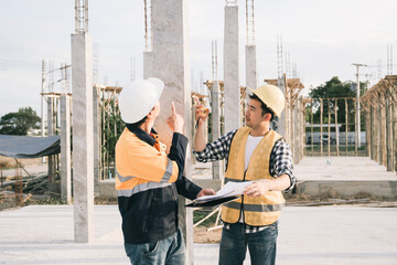 Male and female engineers who are Asian professionals in the construction industry focus on village...