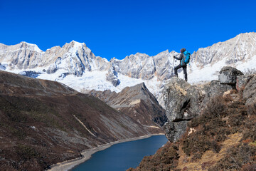 Successful woman hiker on high altitude mountain top