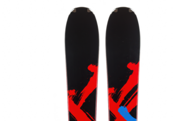 Pair of black skis with red and blue abstract graphics, isolated on a transparent background, showcasing winter sports equipment and design