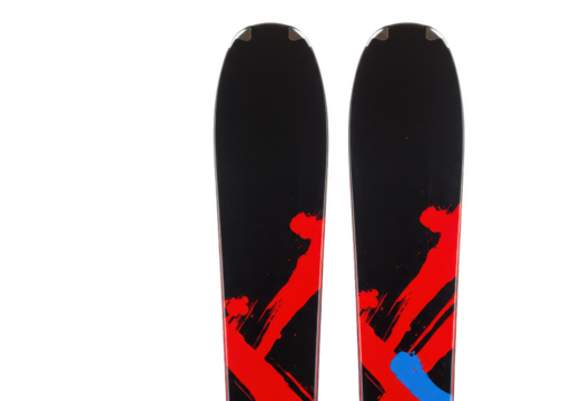 Pair of black skis with red and blue abstract graphics, isolated on a transparent background, showcasing winter sports equipment and design