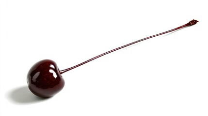 A single, ripe, dark-red cherry with a long stem rests on a stark white background, casting a subtle shadow