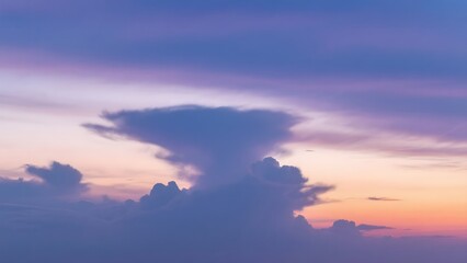 Obraz premium Dramatic Cloudscape at Sunset with Purple and Orange Hues