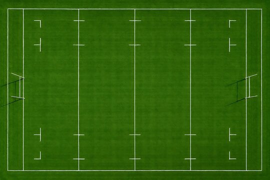 Aerial view of a green rugby field, meticulously marked with crisp, white boundary and goal lines.
