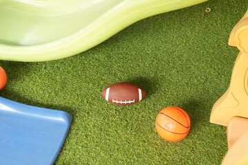 A football and a small basketball at the kids playground
