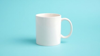 Obraz premium Clean white coffee mug with subtle pink interior against a soft blue backdrop