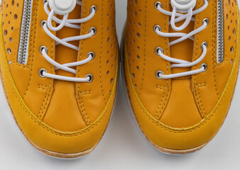 yellow suede sports-style winter boots, isolated