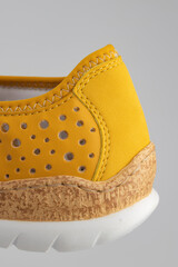 yellow suede sports-style winter boots, isolated