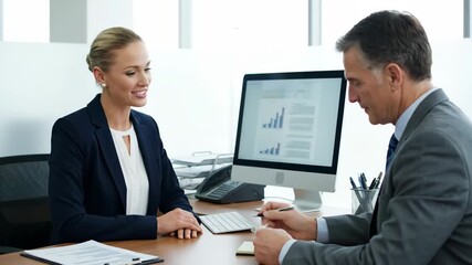 Businesswoman Consulting Client in Office - A friendly female financial advisor or insurance agent sits across from a male client at a desk in a modern office. - Powered by Adobe