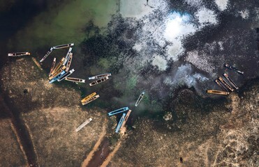 Aerial View of Boats at Lugu Lake Xichang China - Tranquil Mountain Lakeside Retreat with Breathtaking Scenic Views