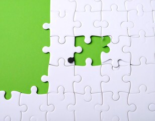 Obraz premium White puzzle pieces with a missing piece against a lime green background