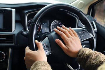 The driver is honking the horn to prevent an accident.