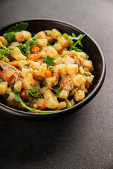 Potato salad with smoked fish tasty snack fresh delicious gourmet food background on the table rustic food top view copy space