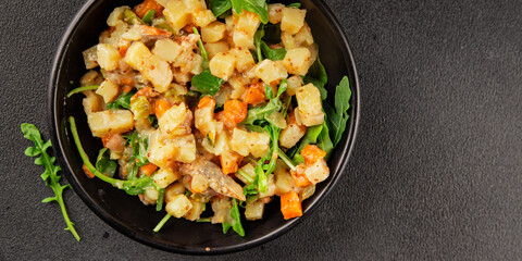 Potato salad with smoked fish tasty snack fresh delicious gourmet food background on the table rustic food top view copy space