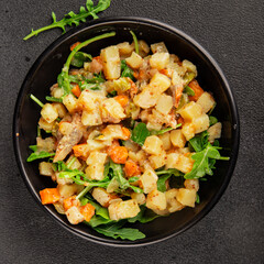 Potato salad with smoked fish tasty snack fresh delicious gourmet food background on the table rustic food top view copy space