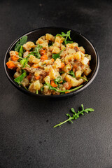 Potato salad with smoked fish tasty snack fresh delicious gourmet food background on the table rustic food top view copy space