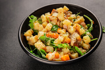 Potato salad with smoked fish tasty snack fresh delicious gourmet food background on the table rustic food top view copy space