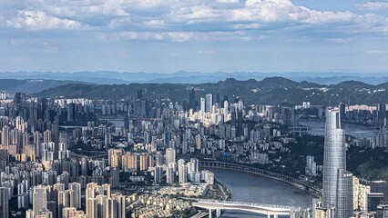 Obraz premium Aerial view of Chongqing city skyline at sunset with mountains and river, China urban landscape