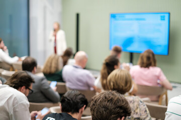 Group of people attending a presentation with a focus on shared professional learning.