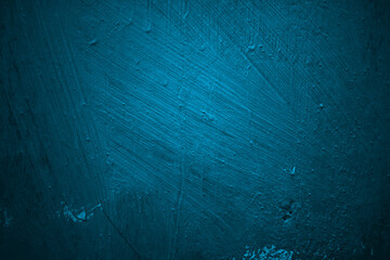 Closeup of textured dark teal wall. Suitable for interior design, background, or wallpaper projects requiring a stylish aesthetic.