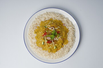 Dal chawal in a plate on white background