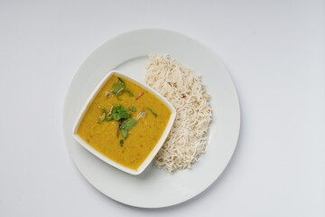 Dal Chawal with bowl of dal in plate on white background