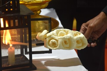 hand burning lantern sandalwood flower and robes for monks in Buddhiat funerel