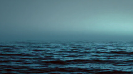 Fototapeta premium Misty ocean horizon with blue and gray water under a calm sky, tranquil seascape, soft atmospheric lighting, high-resolution.