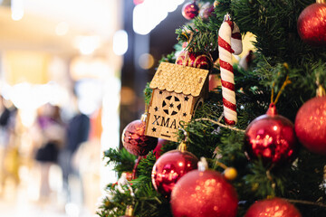 Christmas ornament with ball and gift on pine tree branch merry christmas happy new year