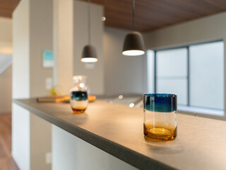 Cozy and Modern Kitchen Counter with Stylish Lighting and Decor
