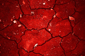 Dry cracked ground in red hues, resembling a desert landscape, perfect for environmental, climate change, and naturerelated designs.