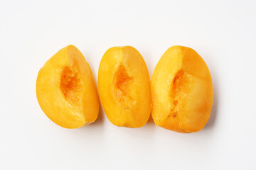 Fresh ripe apricots on a white background.