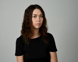 Brunette Girl Model Head and Shoulders Studio Portrait Fresh Faced and Pretty Showing expression...