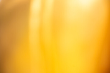 Golden abstract gradient background with smooth, flowing tones of yellow and brown. Perfect for luxury-themed designs, elegant presentations, and digital textures