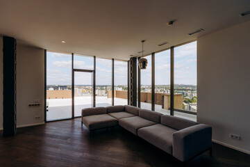 Contemporary Style Modern Living Room Featuring Panoramic Windows and a Stylish Sofa Set