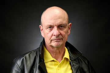 Portrait of a senior man in a vintage Harcourt style lighting