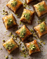 overhead view of baklava pieces with crushed pistachios
