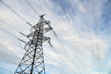 Electric power lines closeup against sky