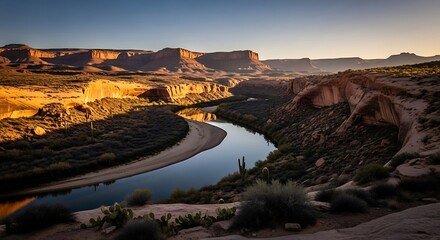Fototapeta premium River Flowing Through Canyon Landscape at Sunset