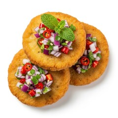 Obraz premium Three golden fried patties topped with fresh red onion chili and mint food snack