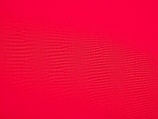 Fototapeta premium Close-up of red yoga leggings fabric texture showing smooth stretch knit material with microfiber surface, breathable and flexible textile for fitness apparel, activewear, and workout clothing design 
