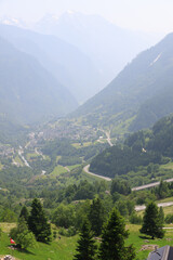 Obraz premium Picturesque alpine landscape with green valley and mountain forest in Switzerland