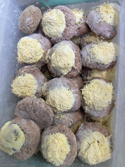 frozen cutlets with cheese in the refrigerator