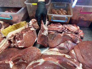 display case with fresh pork tenderloin