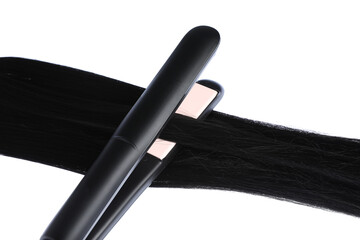 Straightener with black hair lock isolated on white