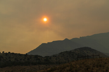 smokey sunset in the mountains