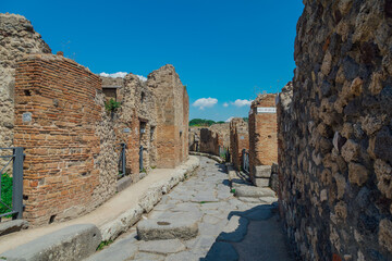 Stone street and columns in the ruins of Pompeii, Italy