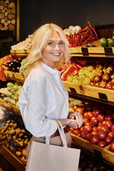 Blonde woman explores local organic produce at modern grocery store