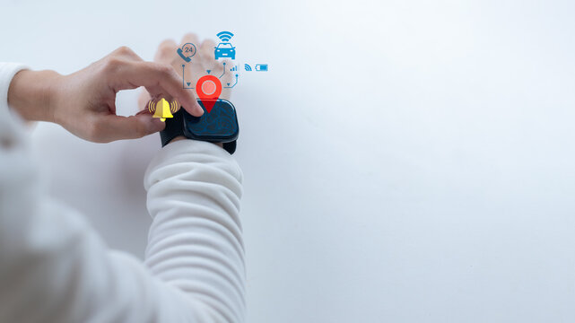 Close-up hand using a smartwatch with a GPS map, location pin, and alert icon. Concept of wearable tech, real-time tracking, and smart notification system.