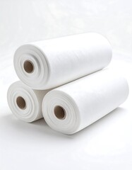 White rolls of absorbent cleaning material
