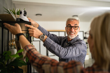 Couple at home connect and install cctv security surveillance camera